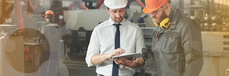 Two employees using tablet at work